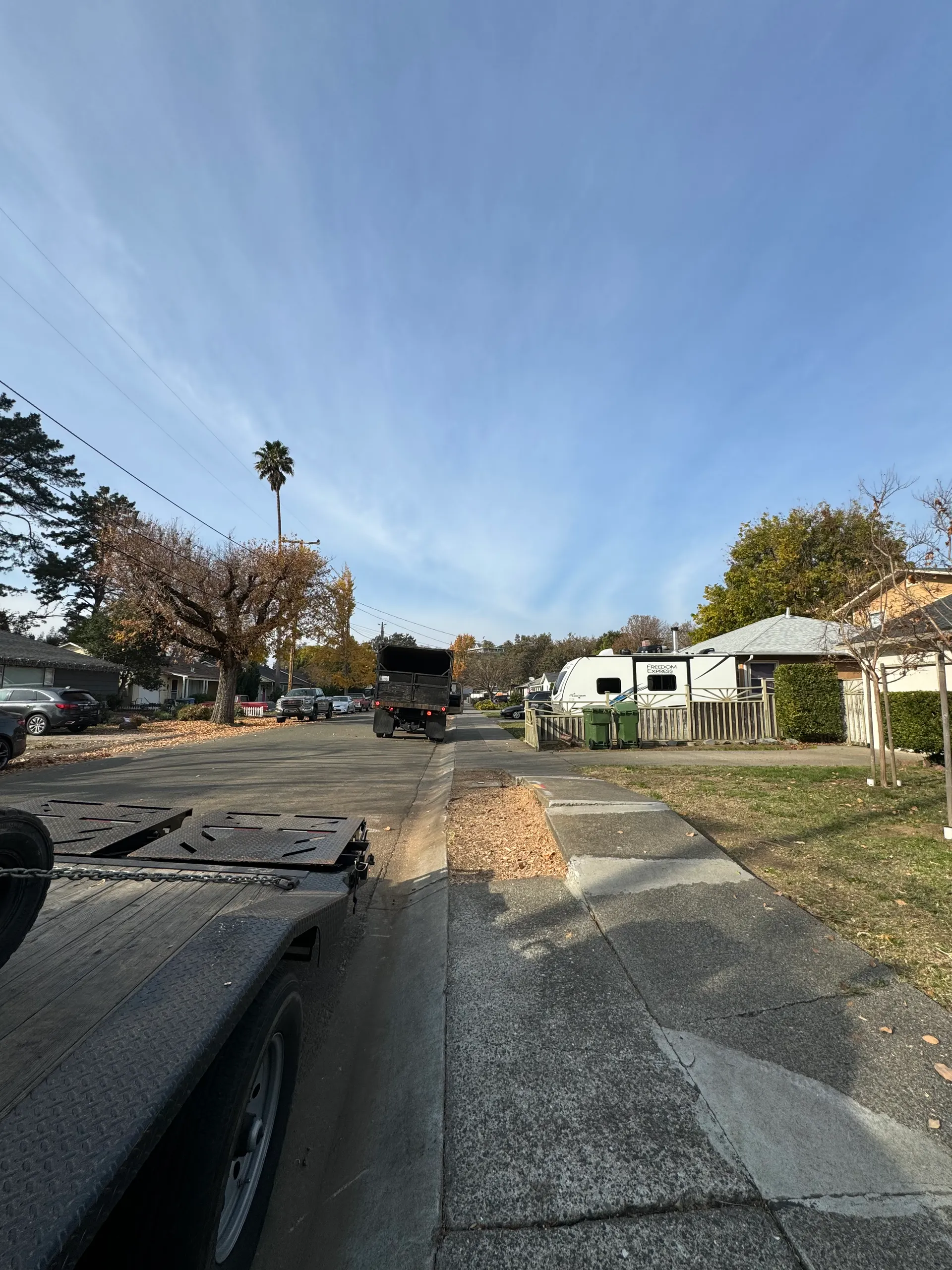 Workers cleaning job site after service